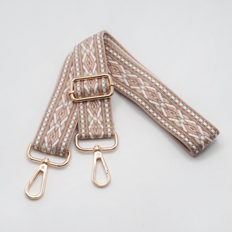 Veskestropp med geometrisk mønster beige krem