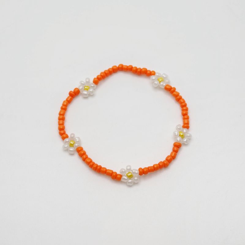 Blomsterarmbånd ensfarget oransje