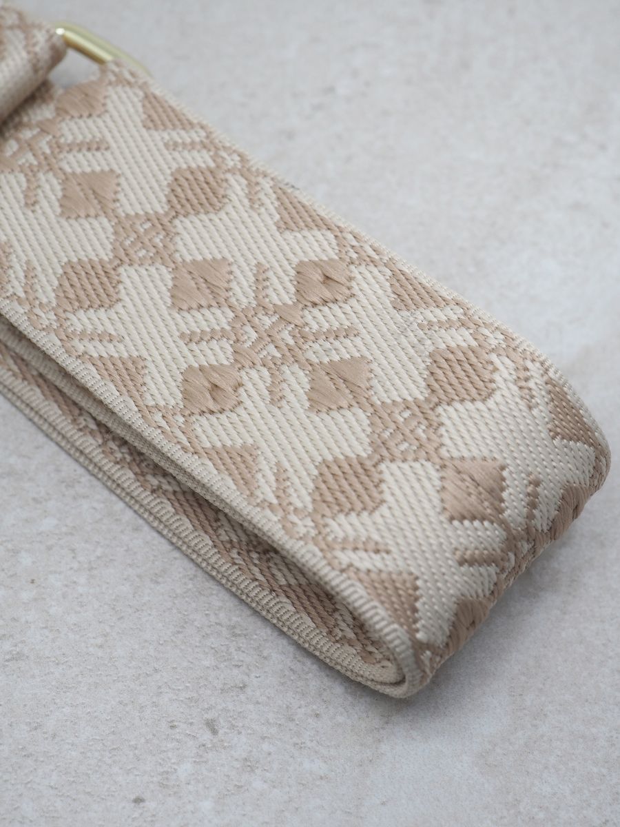 Veskestropp skinndetaljer lyse taupe og hvit 