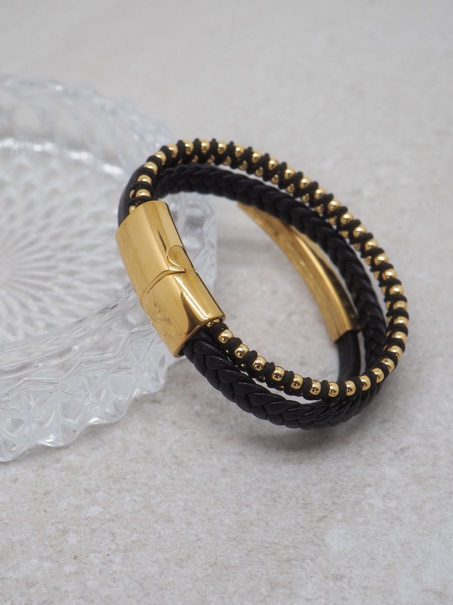 Svart skinnarmbånd med 3 linjer i stål